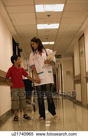 Doctor with a young patient View Large Photo Image Stock Photography - Doctor with a young patient. Fotosearch