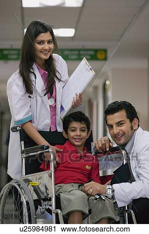 Doctors and a child View Large Photo Image Stock Image - Doctors and a child. Fotosearch
