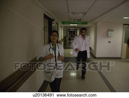 Stock Image - Doctors in a rush. Fotosearch