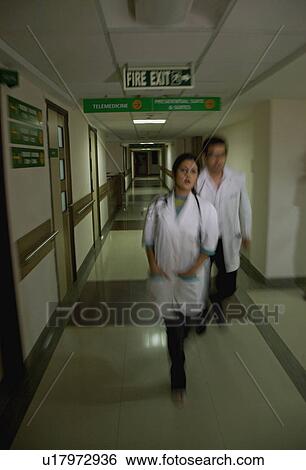 Doctors in a rush View Large Photo Image Stock Photograph - Doctors in a rush. Fotosearch