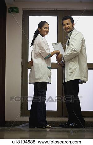 Stock Photo - Doctors in consultation. Fotosearch