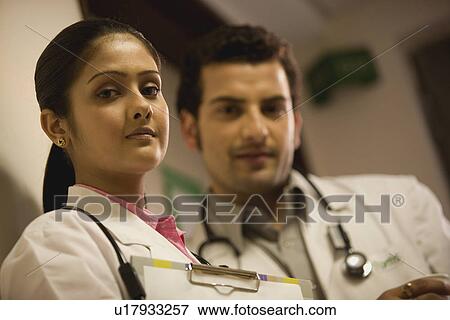 Doctors taking a break View Large Photo Image Stock Photo - Doctors taking a break. Fotosearch