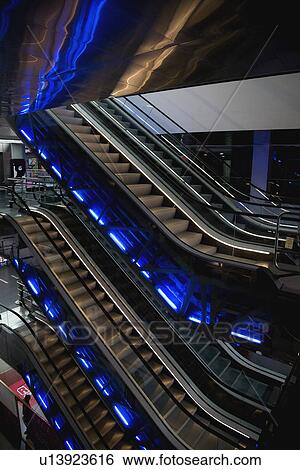Stock Photograph - Escalators in mall. Fotosearch