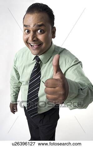 Executive giving a thumbs up View Large Photo Image Stock Photo - Executive giving a thumbs up. Fotosearch