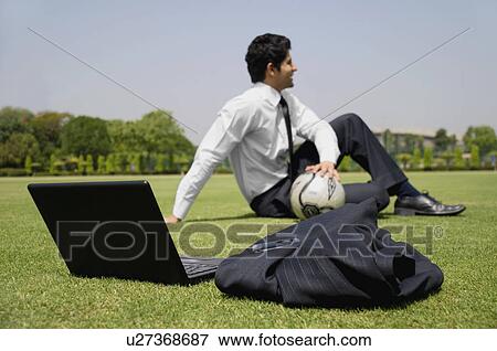 Stock Photo - Executive in a football ground. Fotosearch