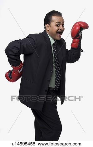 Stock Photo - Executive in boxing gloves. Fotosearch