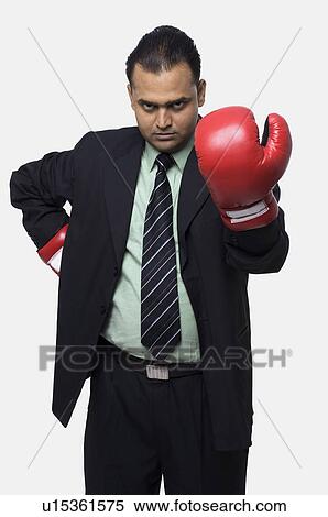 Stock Photography - Executive in boxing gloves. Fotosearch