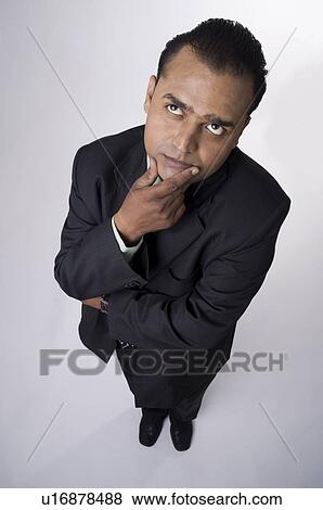 Stock Photo - Executive in deep thought. Fotosearch