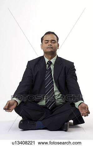 Stock Image - Executive meditating. Fotosearch