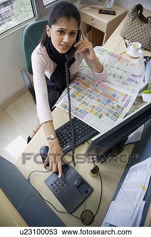 Stock Image - Executive on the phone. Fotosearch