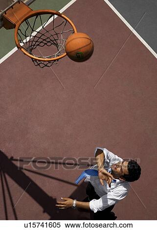 Executive playing basketball View Large Photo Image Stock Photography - Executive playing basketball. Fotosearch