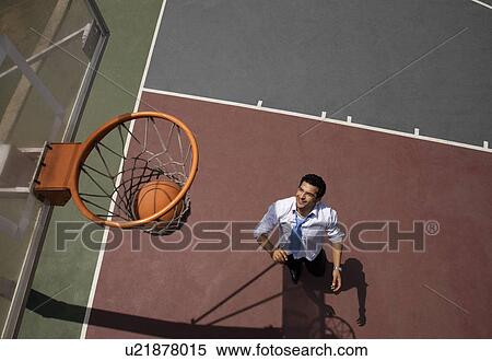 Executive playing basketball View Large Photo Image Stock Photography - Executive playing basketball. Fotosearch