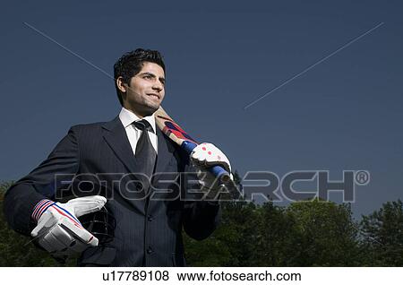 Executive plays cricket View Large Photo Image Stock Photo - Executive plays cricket. Fotosearch