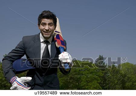 Executive plays cricket View Large Photo Image Stock Photo - Executive plays cricket. Fotosearch