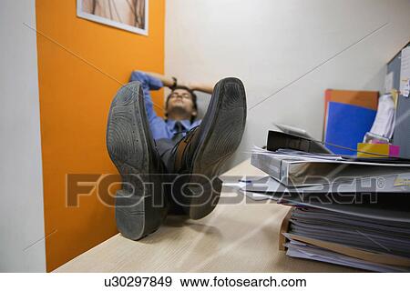 Executive taking a nap View Large Photo Image Stock Photo - Executive taking a nap. Fotosearch
