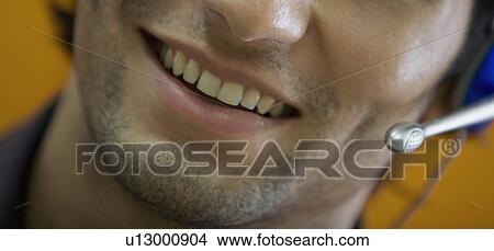 Picture - Executive talking on microphone. Fotosearch