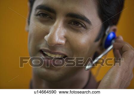 Stock Image - Executive talking on microphone. Fotosearch