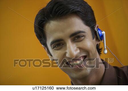 Stock Image - Executive talking on microphone. Fotosearch