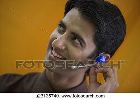 Stock Image - Executive talking on microphone. Fotosearch