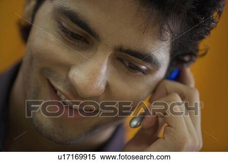 Stock Photography - Executive talking on microphone. Fotosearch