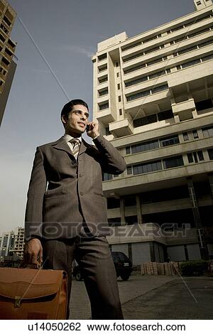 Executive talking on the phone View Large Photo Image Stock Image - Executive talking on the phone. Fotosearch