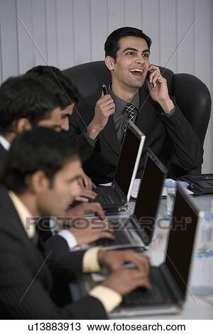 Stock Image - Executive working on a laptop. Fotosearch