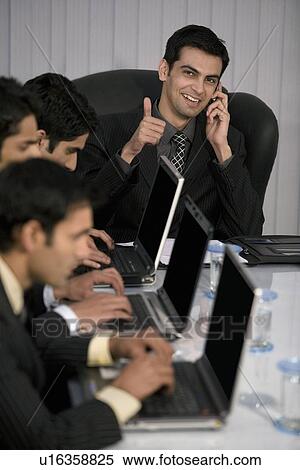 Stock Photography - Executive working on a laptop. Fotosearch