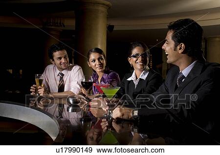 Stock Photo - Executives at the bar. Fotosearch