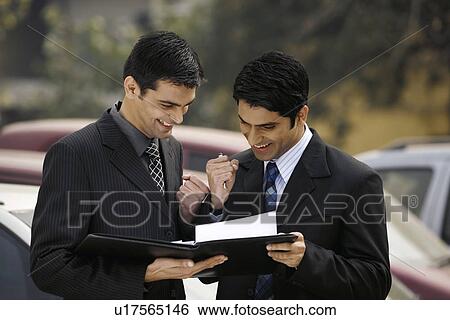Executives having a discussion View Large Photo Image Stock Photograph - Executives having a discussion. Fotosearch