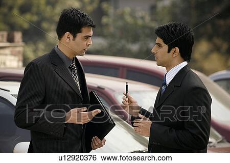 Stock Photograph - Executives in a discussion. Fotosearch