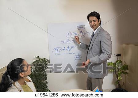 Stock Photograph - Executives in a meeting. Fotosearch