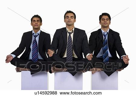 Executives meditating View Large Photo Image Stock Photo - Executives meditating. Fotosearch