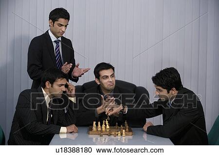 Executives playing chess View Large Photo Image Stock Image - Executives playing chess. Fotosearch