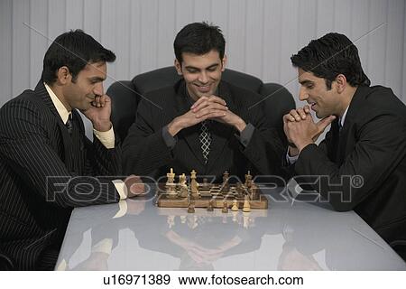 Executives playing chess View Large Photo Image Stock Photo - Executives playing chess. Fotosearch