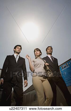 Stock Image - Executives talking on phone. Fotosearch