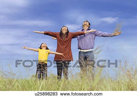 Stock Image - Family at the park. Fotosearch