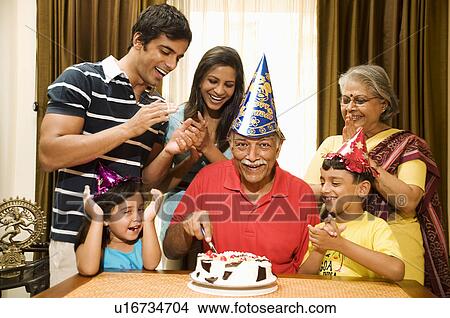Picture - Family celebrating a birthday. Fotosearch