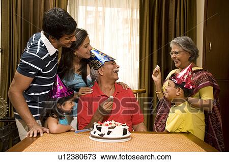 Family celebrating a birthday View Large Photo Image Stock Image - Family celebrating a birthday. Fotosearch