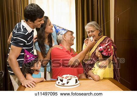 Family celebrating a birthday View Large Photo Image Stock Photography - Family celebrating a birthday. Fotosearch