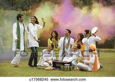 Stock Photography - Family celebrating Holi. Fotosearch