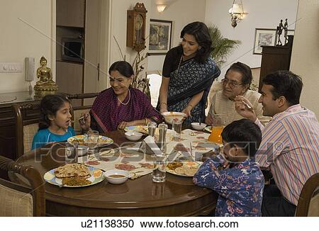 Family having lunch View Large Photo Image Stock Image - Family having lunch. Fotosearch