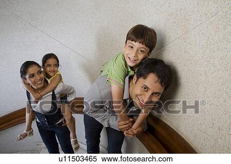 Stock Photography - Family posing on the stairs. Fotosearch