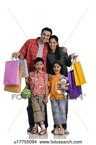 Picture - Family with shopping bags. Fotosearch