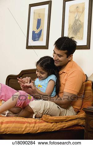Picture - Father and daughter having fun. Fotosearch