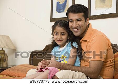 Stock Image - Father and daughter having fun. Fotosearch