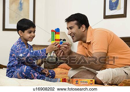 Stock Image - Father and son having fun. Fotosearch
