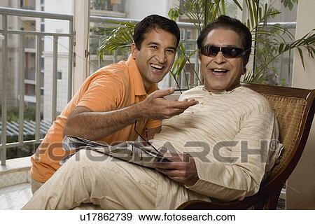 Father and son having fun View Large Photo Image Stock Photo - Father and son having fun. Fotosearch
