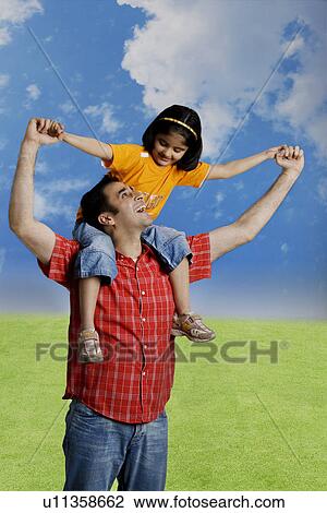 Father playing with his daughter View Large Photo Image Stock Image - Father playing with his daughter. Fotosearch
