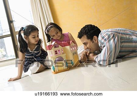 Father playing with his daughters View Large Photo Image Stock Image - Father playing with his daughters. Fotosearch