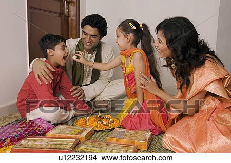 Feeding sweets View Large Photo Image Picture - Feeding sweets. Fotosearch
